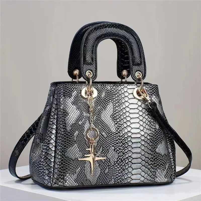 Snake patterned leather handbag