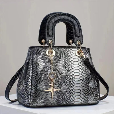 Snake patterned leather handbag