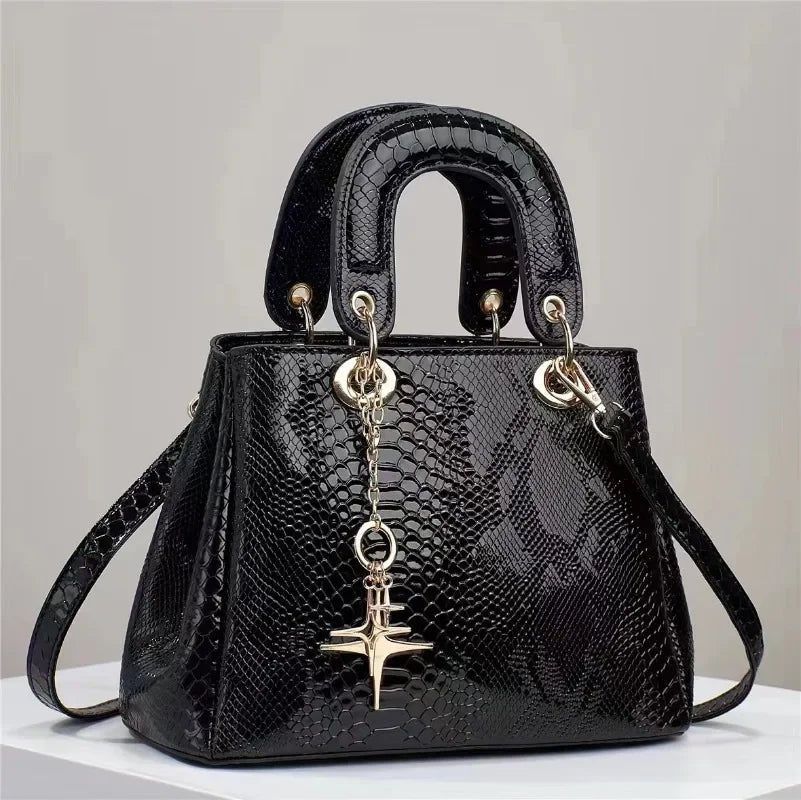 Snake patterned leather handbag