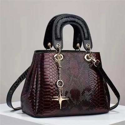 Snake patterned leather handbag